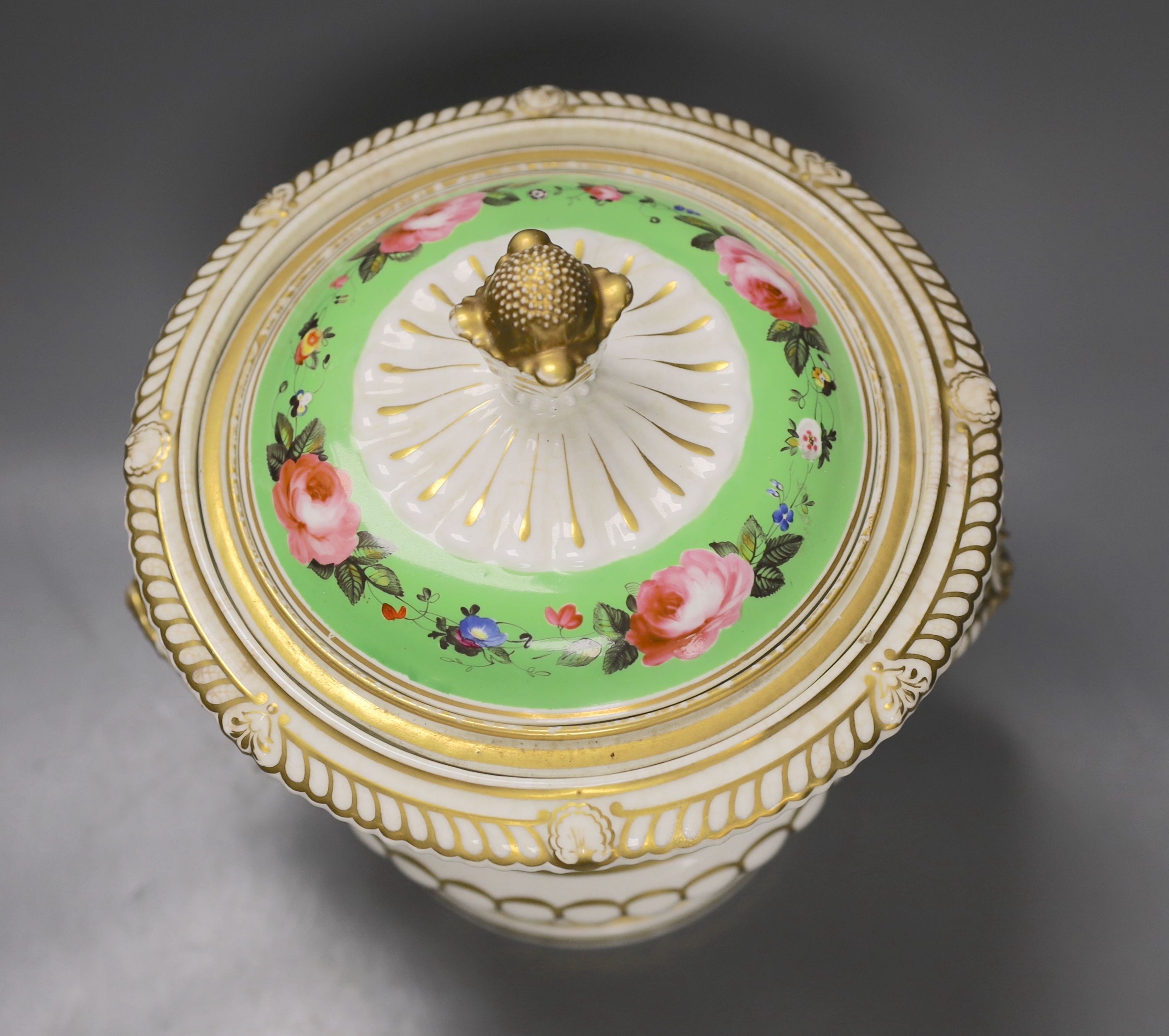 An English porcelain campana shaped ice pail and two covers painted with flowers and a green ground, c.1830 (handles re-attached) 30cm